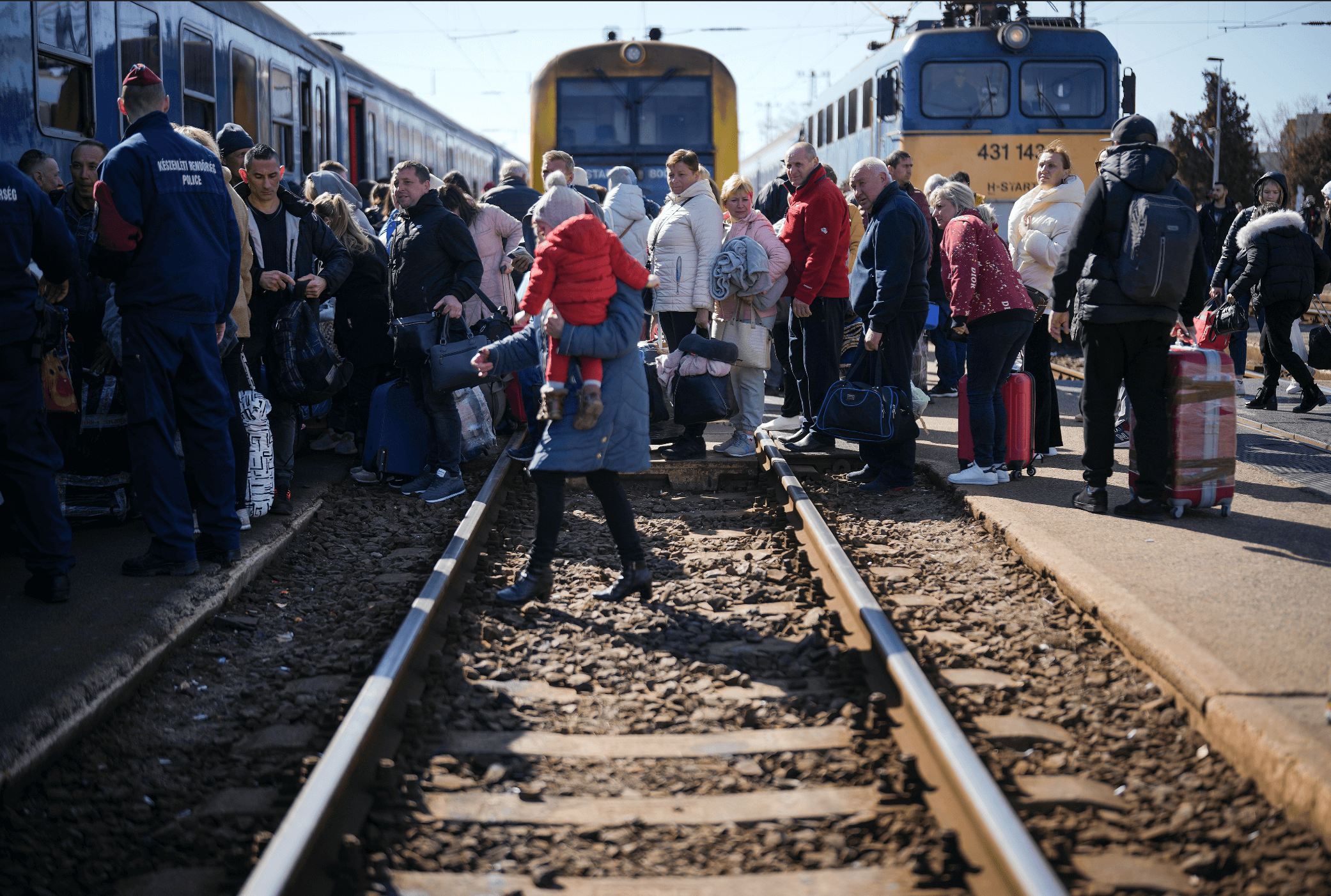 PEOPLE-QUEUE-TO-BOARD-A-TRAIN-BACK-TO-UKRAINE-ACROSS-THE-BORDER-FROM-HUNGARY
